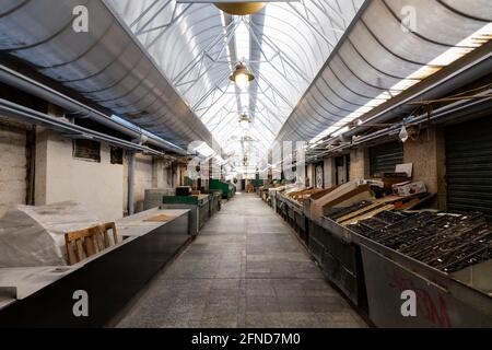 An empty alley of the Iraqi Market at the Mahane Yehuda Market during Sabbath with all the stores closed. Stock Photo