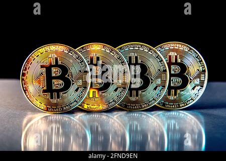 Row of golden bitcoin cryptocurrency token coins Stock Photo