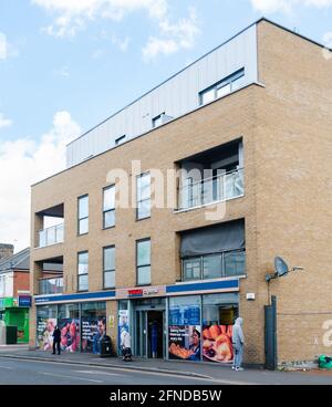 London, United Kingdom, 8 May, 2021: A Tesco Metro store Street scene with local people outside Tesco Metro store shop front in Forest Gate, Newham Stock Photo