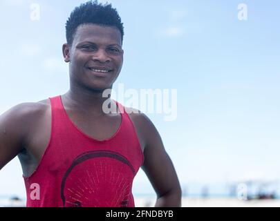 Young black man working on the coast Stock Photo