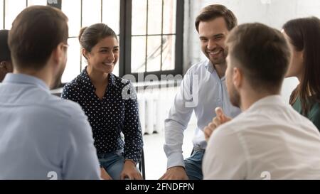 Happy millennial diverse group discussing personal problems Stock Photo