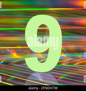 Number nine on abstract multicolored holographic background. Disco lights style. Stock Photo