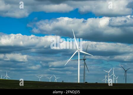 Windmills on the plains of Oklahoma under a dramatic cloudy sky Stock Photo