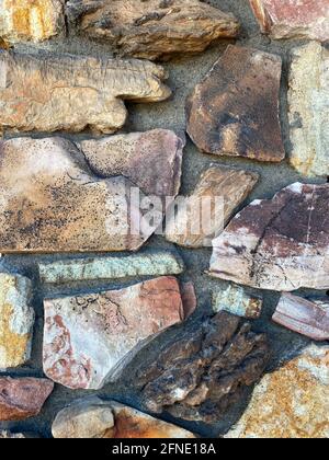 ancient old aged rock stone castle fort fortress or formal stately home estate garden wall facade Stock Photo
