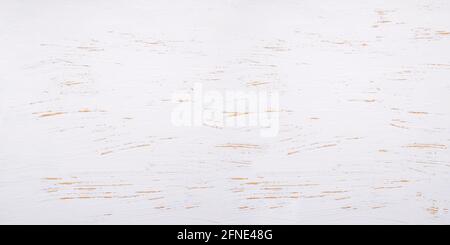 Background of old aged rough white painted wooden boards with scratch texture .Vintage white wooden table background top view. Stock Photo