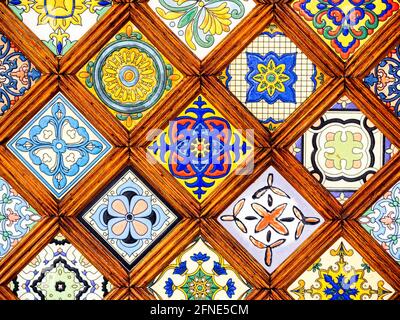 Close up beautiful vintage pattern of colorful stained glass window moroccan style background. Close-up classic pattern of wooden stained glass. Stock Photo