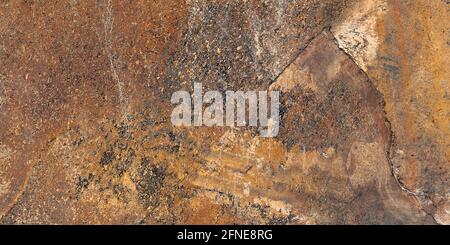 brown color original stone texture rustic finish surface use for wall tiles and wall paper Stock Photo