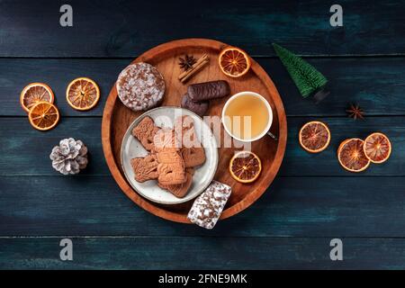 Spekulatius and Elisen, German Christmas gingerbread cookies, overhead flat lay shot on a dark blue background Stock Photo