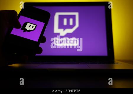 Logo of the streaming platform twitch for gamers on a laptop and a smartphone Stock Photo