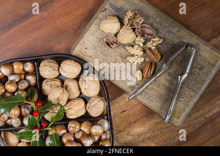 Edible nuts and nutcrackers on table at christmas, England, United Kingdom Stock Photo