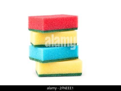 Red, yellow and blue sponges for dishwashing isolated on white. Sponge for washing dirty dishes Stock Photo