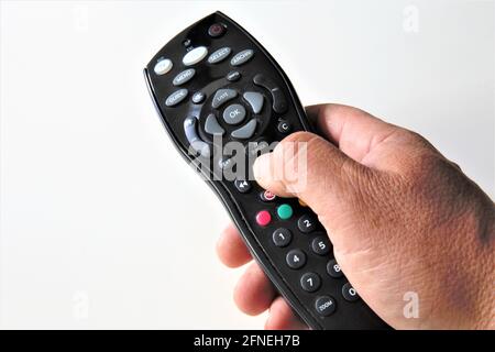 tv remote control in hand Stock Photo