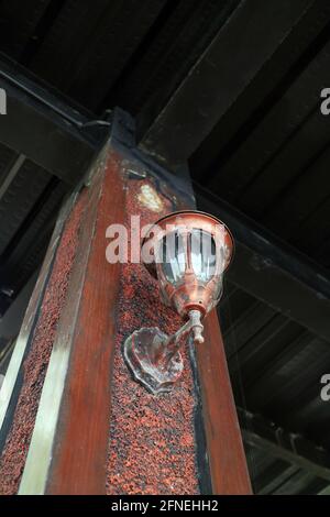 an old lamp on a pillar of the house photo Stock Photo