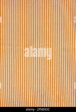 Orange striped tablecloth background texture. Fabric wallpaper Stock Photo