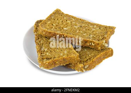 Three pieces of cereal bread on porcelain white saucer, isolated on white background. Stock Photo