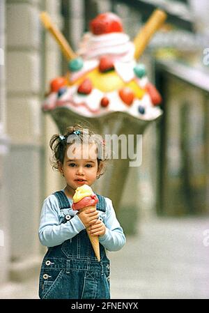 High season for sweet tooths The warmer the days, the bigger the ice cream. For two-year-old Vivien from Munich, the ice cream portions can't be big enough at the moment. [automated translation] Stock Photo