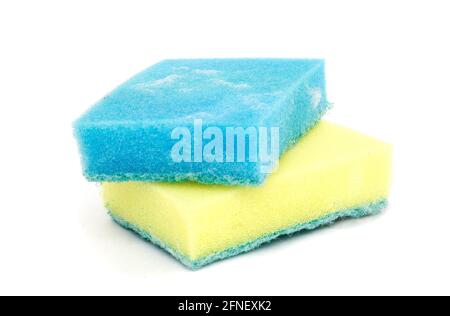 Premium Photo  Blue and yellow sponges isolated on white background