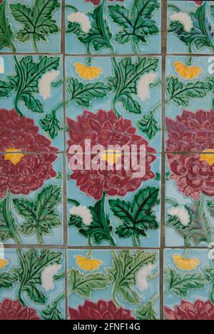 Floral ceramic tiles on walls of five foot passage along row of conserved prewar terrace houses designed in Chinese Baroque style, Petain Road, S'pore Stock Photo