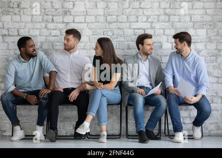 Vacancy applicants talking, discussing employment and hiring Stock Photo