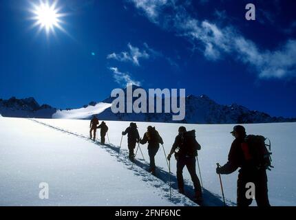 A group on a ski tour in the Stubai Alps.n [automated translation] Stock Photo