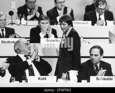 Federal Chancellor and CDU Chairman Helmut Kohl applauds his newly elected deputy, Federal Minister for Women's Affairs Angela Merkel, at the federal party conference of the CDU in Dresden. To the right of her is CDU/CSU parliamentary party leader Wolfgang Schäuble, in the background from left to right. Kurt Biedenkopf and Alfred Gomolka. [automated translation] Stock Photo