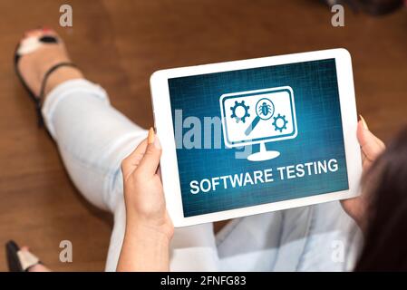 Tablet screen displaying a software testing concept Stock Photo