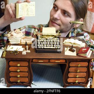 15 May 2021, Saxony, Leipzig: The Leipzig computer science student and filmmaker Valentin Felder sits in his small workshop behind miniature props for his half-hour film 'Gear in the Sand'. He has already turned, filed, soldered and milled thousands of parts, ranging in size from 0.5 millimetres to a few centimetres, made of copper, brass, wood, steel, plaster or polystyrene for his robots and machines. He documents the development of this creative project, which should be finished in three years at the latest, online and receives small donations from all over the world for it. Photo: Waltrau Stock Photo