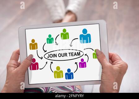 Join our team concept shown on a tablet held by a woman Stock Photo