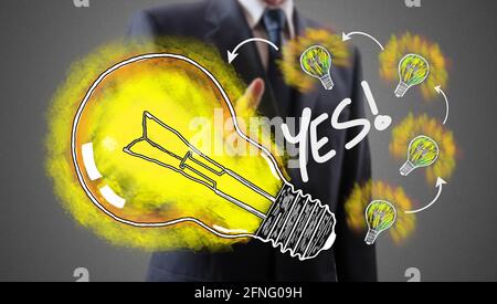 Ideas concept shown by a businessman in background Stock Photo