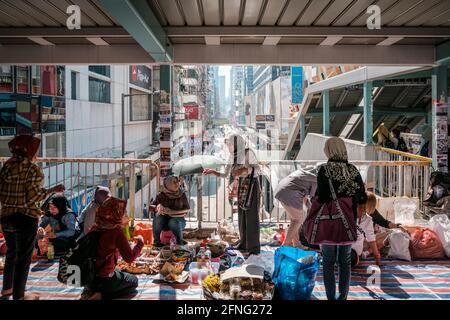 Hong Kong - November, 2019: Women, maids mostly from the phillipines indonesia mainland china on sunday, their day off in Hong Kong Stock Photo