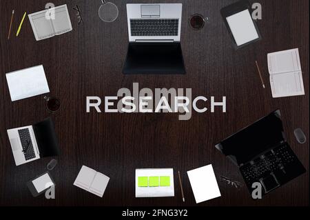 Research concept. Top layout of drawings of laptops, notepads, coffee, different business stuff on black background. Stock Photo