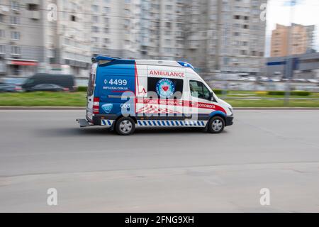 Ukraine, Kyiv - 26 April 2021: Ambulance car moving on the street. Editorial Stock Photo