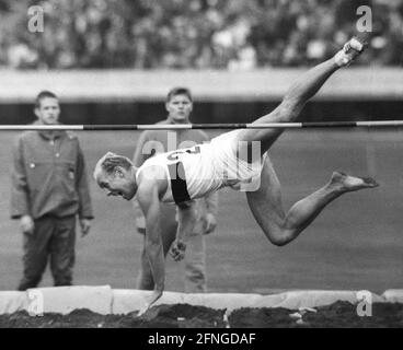 Summer Olympics in Tokyo 1964. Athletics: 10-fight. Willi Holdorf (Germany) loses a shoe during the high jump. Rec. 20.10.1964. [automated translation] Stock Photo