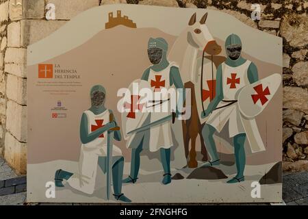 photo stand-in of three Knights Templar with holes in their heads for tourists to pose behind. Painted board with hole for head in Alcala de Xivert. Stock Photo