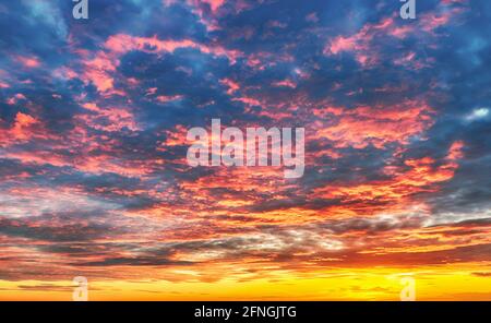 Only sky at sunset, abstract view with red and orange clouds Stock Photo
