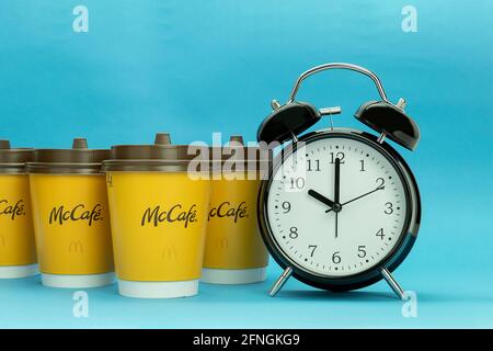 Morning red alarm clock and disposable paper cup or mug isolated on white with clipping path Stock Photo