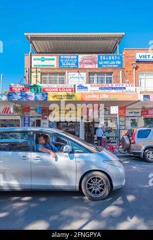 Islander people sit in traffic in the crowded Saturday morning streets of Cabramatta in Sydney's western suburbs in Australia Stock Photo