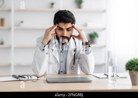 Overwork, first symptoms of illness, migraine, feeling unwell Stock Photo