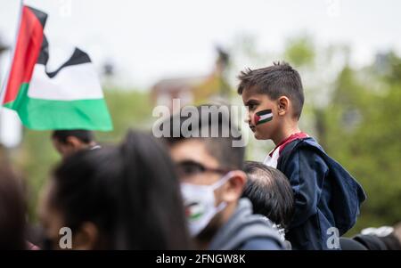 Manchester, UK. 16th May, 2021. A kid looks on during the demonstration.Hundreds of people from across the community come together in solidarity with the People of Palestine, at a Free Palestine Protest. Credit: SOPA Images Limited/Alamy Live News Stock Photo