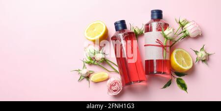 Natural shower gels and ingredients on pink background Stock Photo