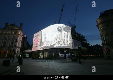 Testing of a new advert that has a 3D zombie tiger emerging from the Piccadilly Lights screen in Piccadilly Circus to mark the release of director Zack Snyder's new blockbuster. The huge visual effects tiger, named Valentine, features in the Netflix film Army Of The Dead, which also stars Dave Bautista and Ella Purnell. Picture date: Thursday May 6, 2021. Stock Photo