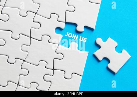 Join us message on missing puzzle piece. Recruitment, membership or to join a cause concept. Stock Photo