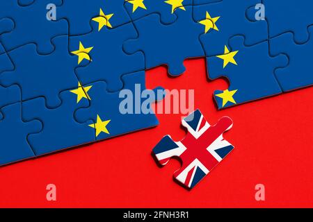Brexit concept. Missing puzzle piece with Great Britain flag exits from the European Union flag. Stock Photo
