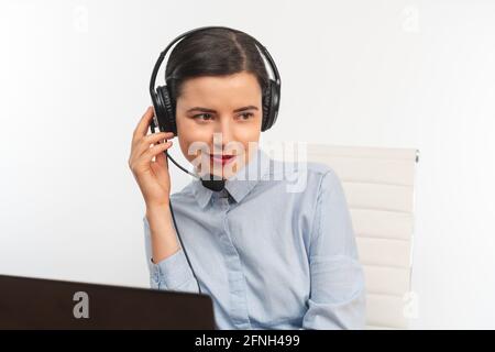 Pretty smiling business woman with headset Stock Photo