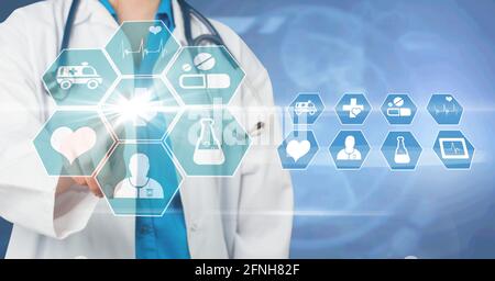 Composition of male doctor touching virtual screen with medical icons on blue background Stock Photo