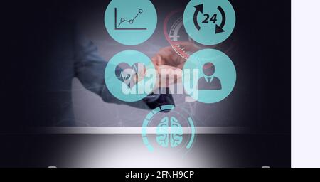 Composition of businessman touching screen with icons and medical data Stock Photo