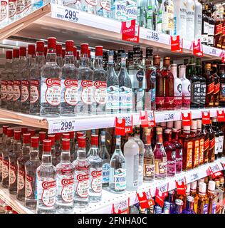 Samara, Russia - May 15, 2021: Various bottled strong alcoholic beverages ready for sale on supermarket shelves Stock Photo