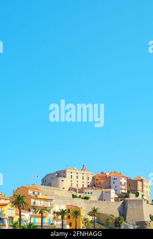 a view of the famous citadel of Calvi, in Corsica, France, against the blue sky in a clear summer day, with some blank space on top Stock Photo