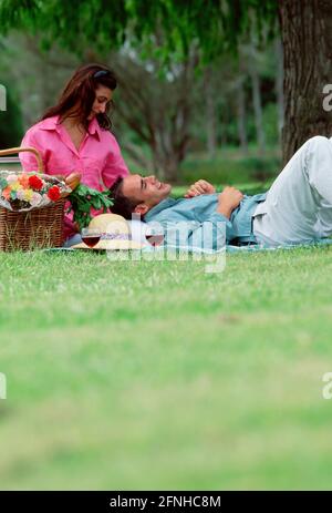 Australia. Lifestyle. Young couple outdoors picnic in the park. Stock Photo