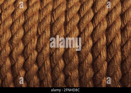 Closeup rope background. Low light brown rope texture. Horizontal gradient pattern. Stock Photo